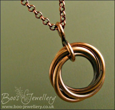 Antiqued copper mobius flower pendant on belcher chain
