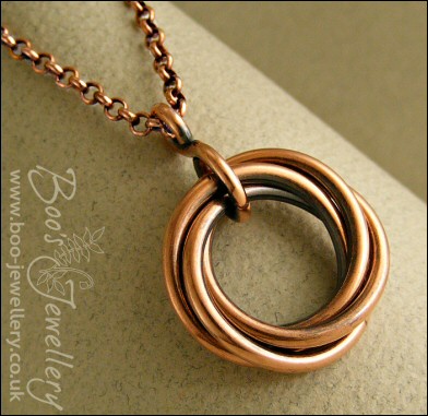 Antiqued copper mobius flower pendant on belcher chain