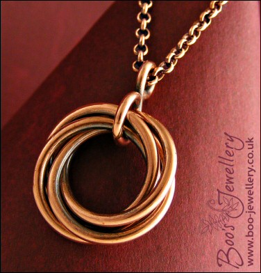 Antiqued copper mobius flower pendant on belcher chain