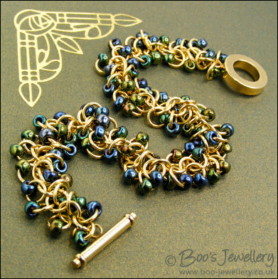 Gold plated Shaggy Loops bracelet in blue greens