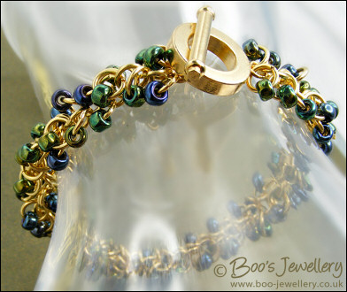 Gold plated Shaggy Loops bracelet in blue greens