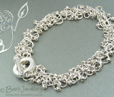 Silver plated shaggy loops bracelet and earrings