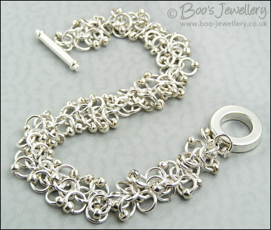 Silver plated shaggy loops bracelet and earrings