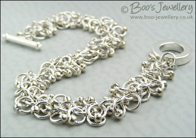 Silver plated shaggy loops bracelet and earrings