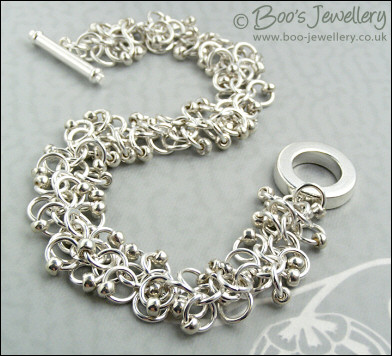 Silver plated shaggy loops bracelet and earrings