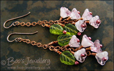 Chain earrings with pink glass blossoms on rosy red copper