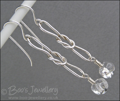 Sterling silver knot earrings with icy rock crystal chips