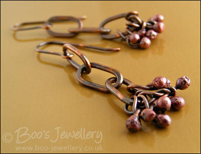 Antiqued copper long link earrings with rosy copper buds