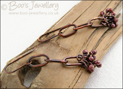 Antiqued copper long link earrings with rosy copper buds