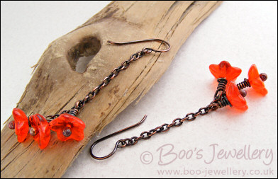 Copper chain earrings with orange glass flowers