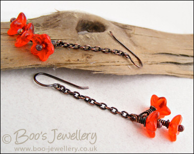 Copper chain earrings with orange glass flowers