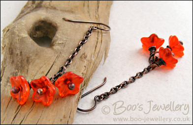Copper chain earrings with orange glass flowers