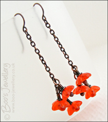 Copper chain earrings with orange glass flowers