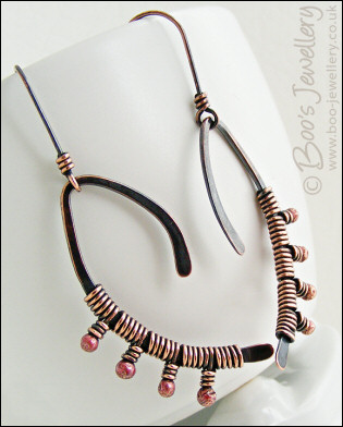 Asymmetric copper wishbone earrings with rosy copper buds