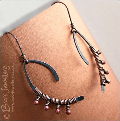 Asymmetric copper wishbone earrings with rosy copper buds