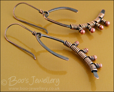 Asymmetric copper wishbone earrings with rosy copper buds