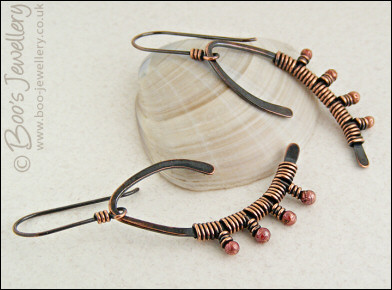 Asymmetric copper wishbone earrings with rosy copper buds