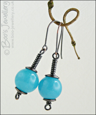 Darkly gunmetal copper earrings with turquoise dyed jade