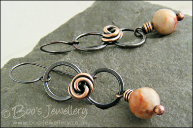 Oxidised figure of 8 copper earrings with rosebud knot