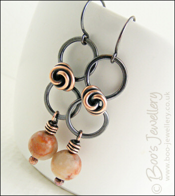 Oxidised figure of 8 copper earrings with rosebud knot