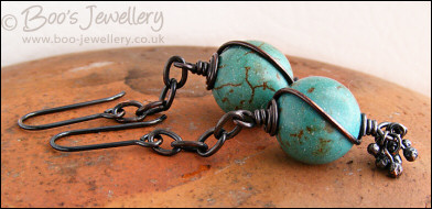 Turquoise and antiqued copper earrings with molten buds