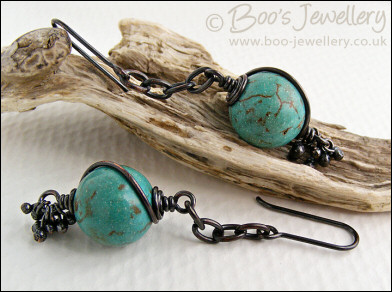 Turquoise and antiqued copper earrings with molten buds