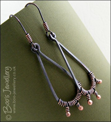 Long dark teardrop earrings with rosy buds