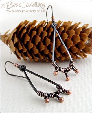Long dark teardrop earrings with rosy buds