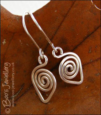 Spiralled leaf shape Sterling silver earrings