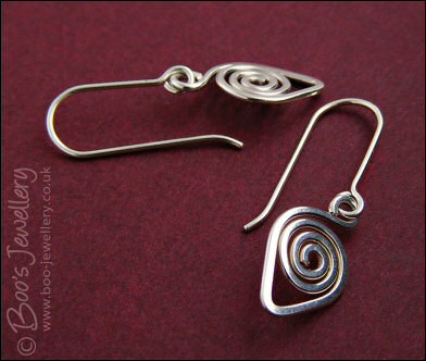 Spiralled leaf shape Sterling silver earrings