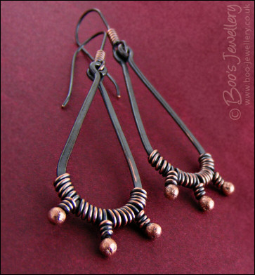 Long dark teardrop earrings with rosy buds