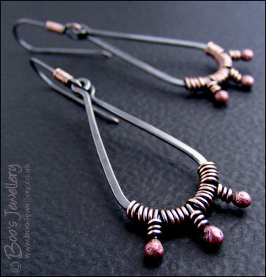 Long dark teardrop earrings with rosy buds