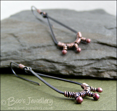 Long dark teardrop earrings with rosy buds