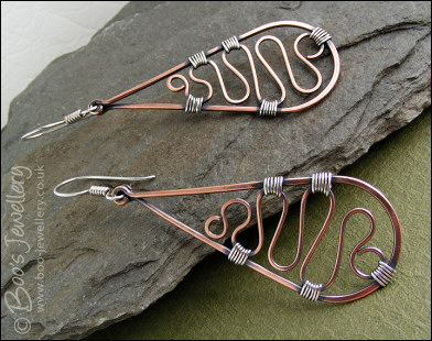 Teardrop earrings filled with squiggles wrapped with silver