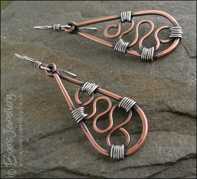 Squiggle filled teardrop earrings in copper and silver
