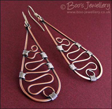 Teardrop earrings filled with squiggles wrapped with silver