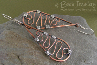 Teardrop earrings filled with squiggles wrapped with silver