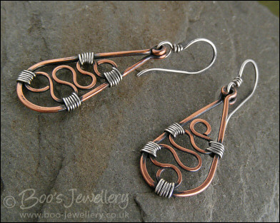 Squiggle filled teardrop earrings in copper and silver