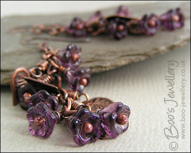 Long flower and leaf cluster earrings