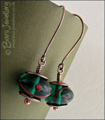 Antiqued copper and green glass long drop earrings