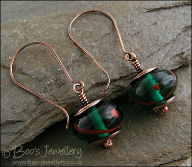 Antiqued copper and green glass long drop earrings