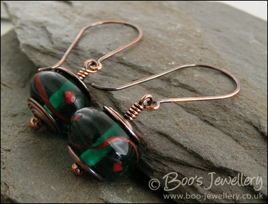 Antiqued copper and green glass long drop earrings