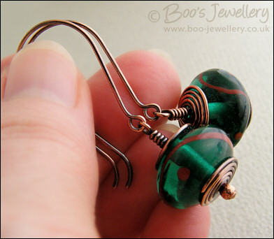 Antiqued copper and green glass long drop earrings