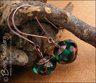 Antiqued copper and green glass long drop earrings