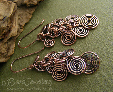 Fluid copper spirals earrings