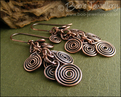 Fluid copper spirals earrings