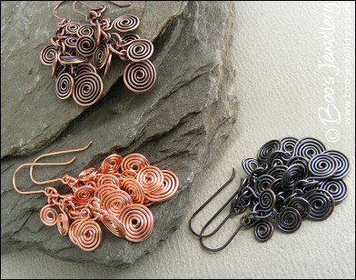 Fluid copper spirals earrings