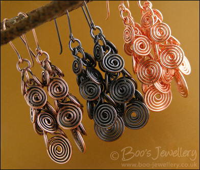 Fluid copper spirals earrings