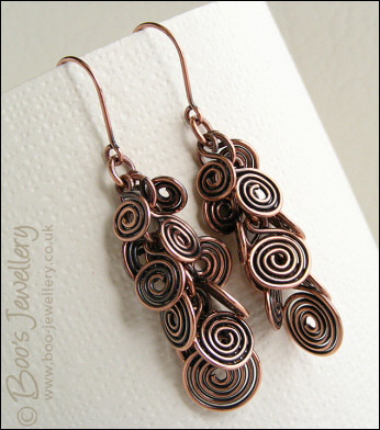Fluid copper spirals earrings