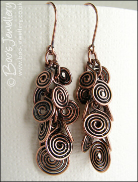Fluid copper spirals earrings